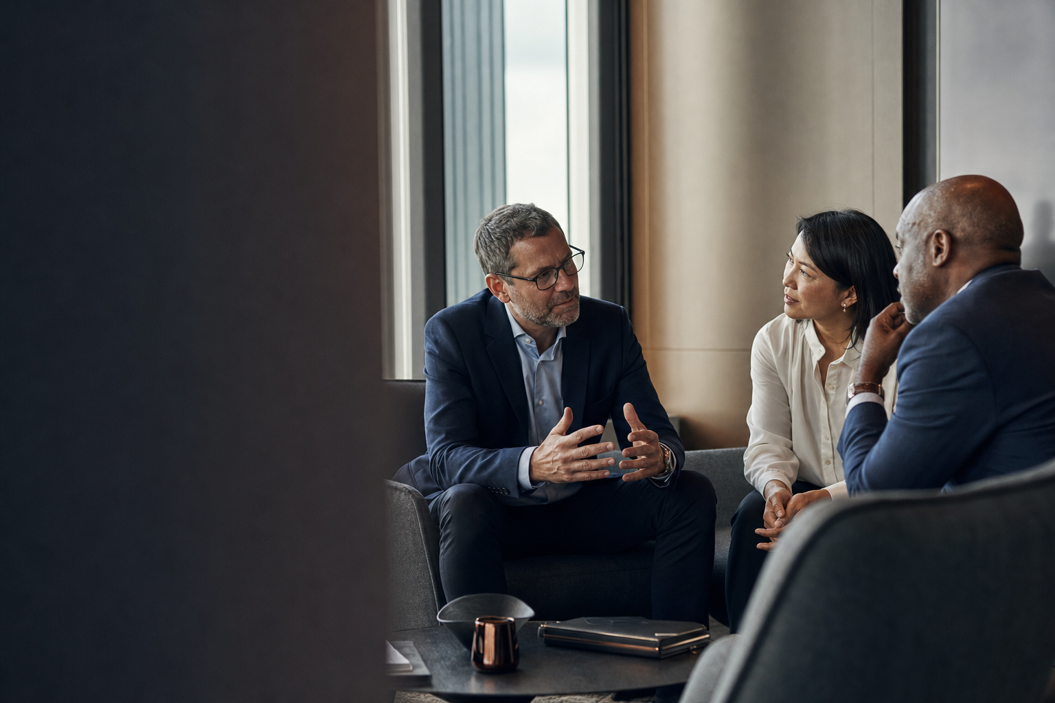 Senior business leaders in a focused advisory conversation